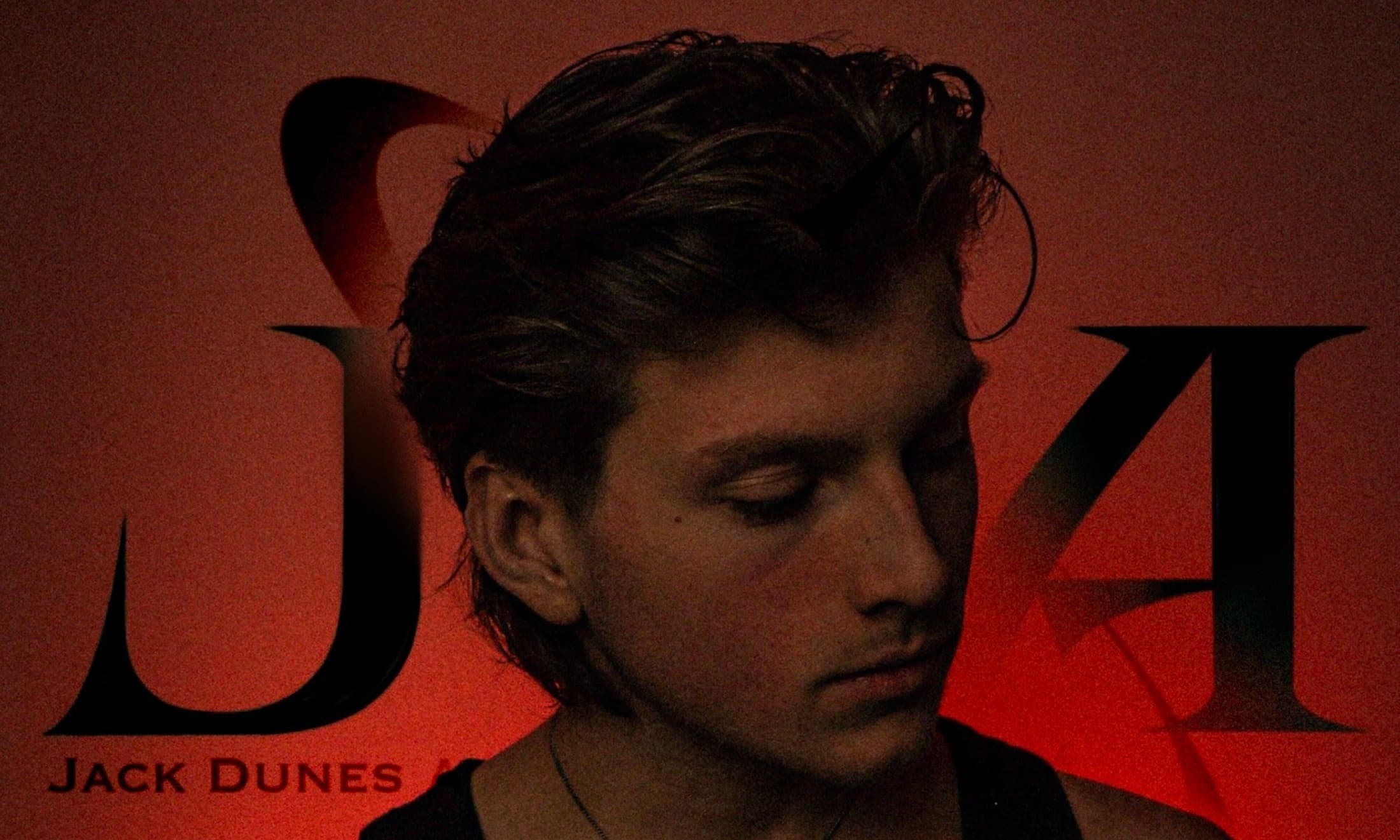 Jack Dunes in front of the JDA logo